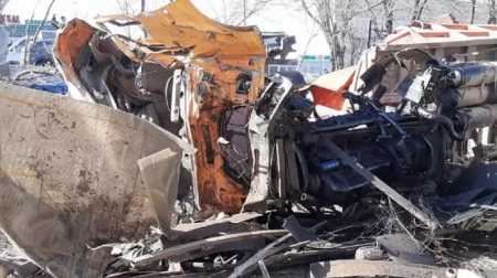 Грузовик на скорости врезался в легковушку и снес забор дома в Алматы